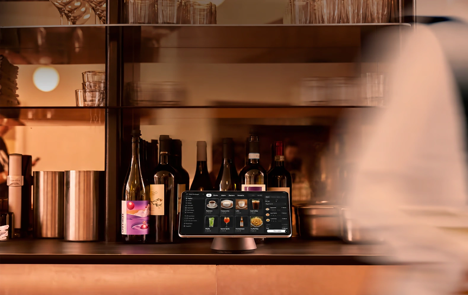A warmly lit bar counter, ready to welcome guests